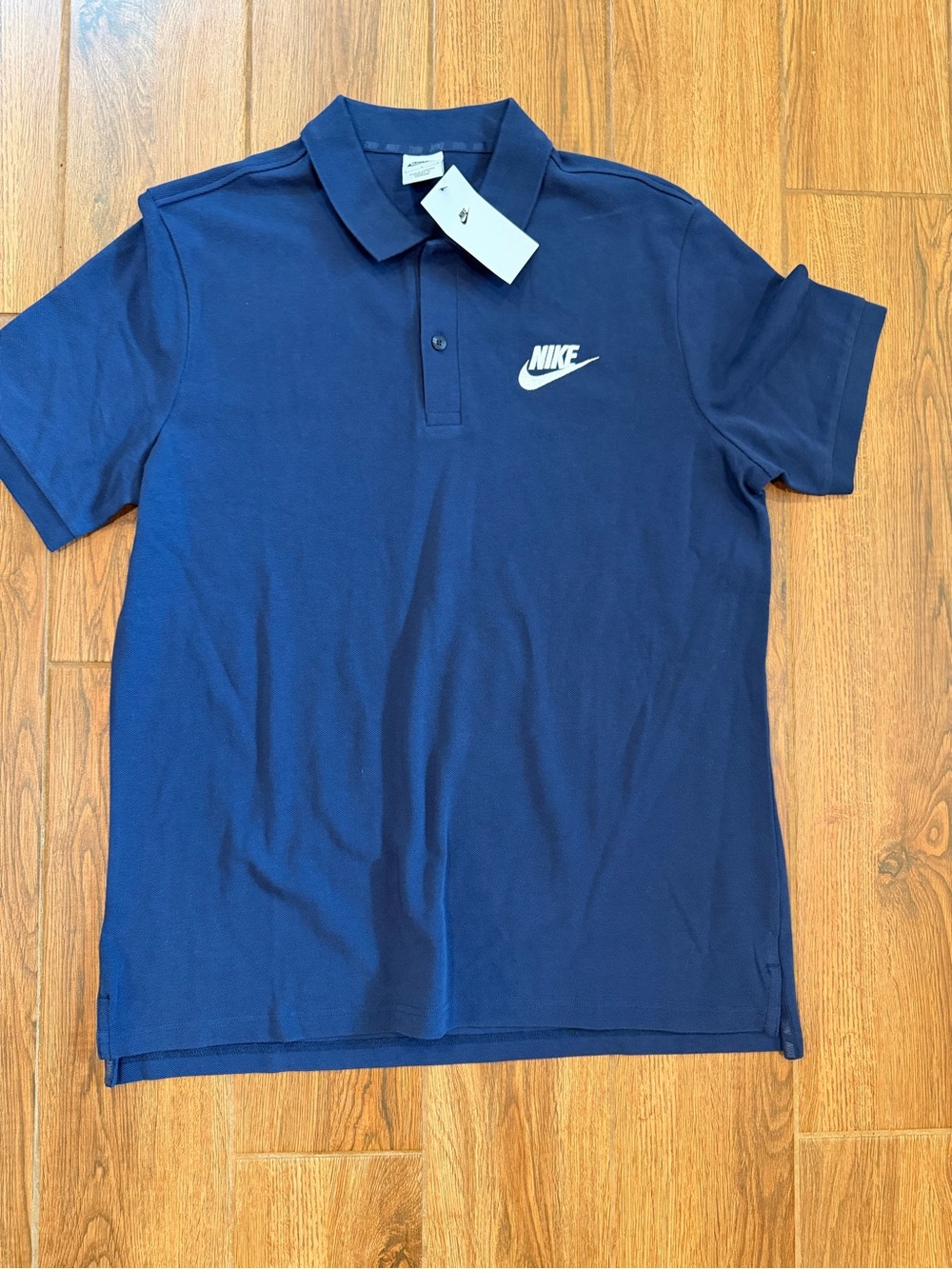 NWT / Nike Men’s Dark Blue Polo with White Swoosh / large